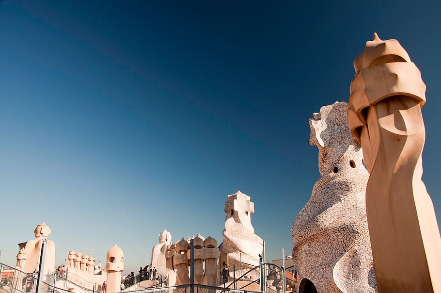 low, angle photography, brown, concrete, statues, walls, casa mila, gaudi, spain, sunny