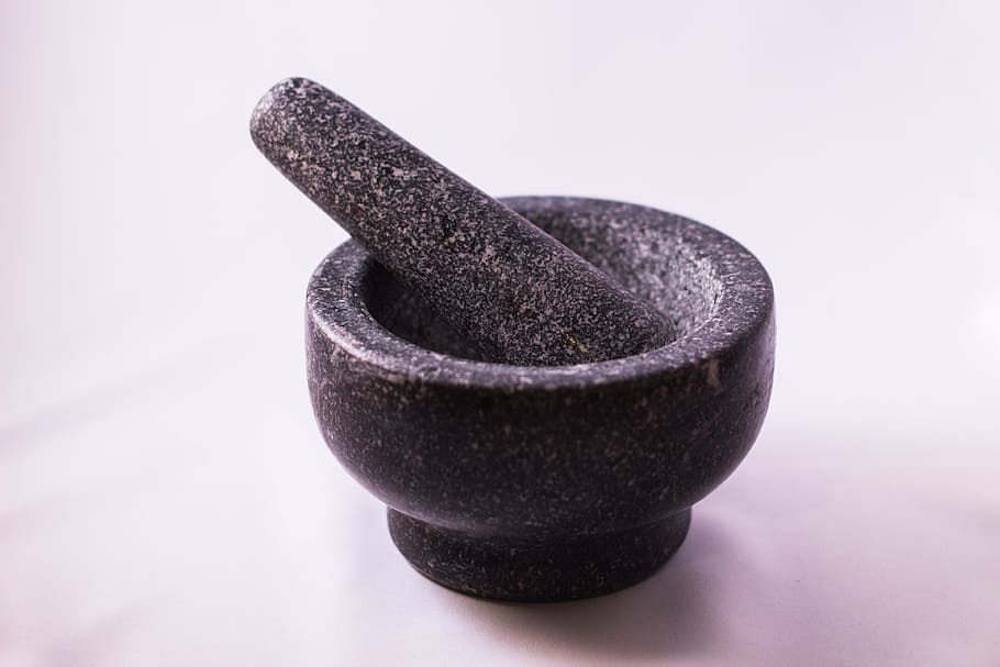 black, stone mortar, pestle, placed, white, surface, mortar, kitchen utensils, presses, stamping
