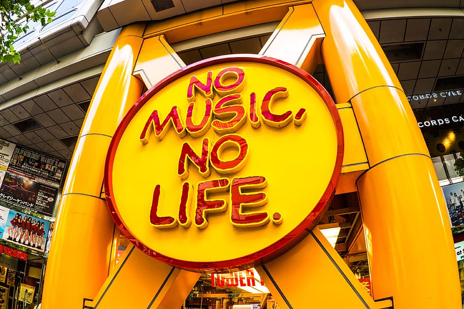 tower records, tower leh code, billboard, shibuya, music, yellow, architecture, communication, low angle view, text