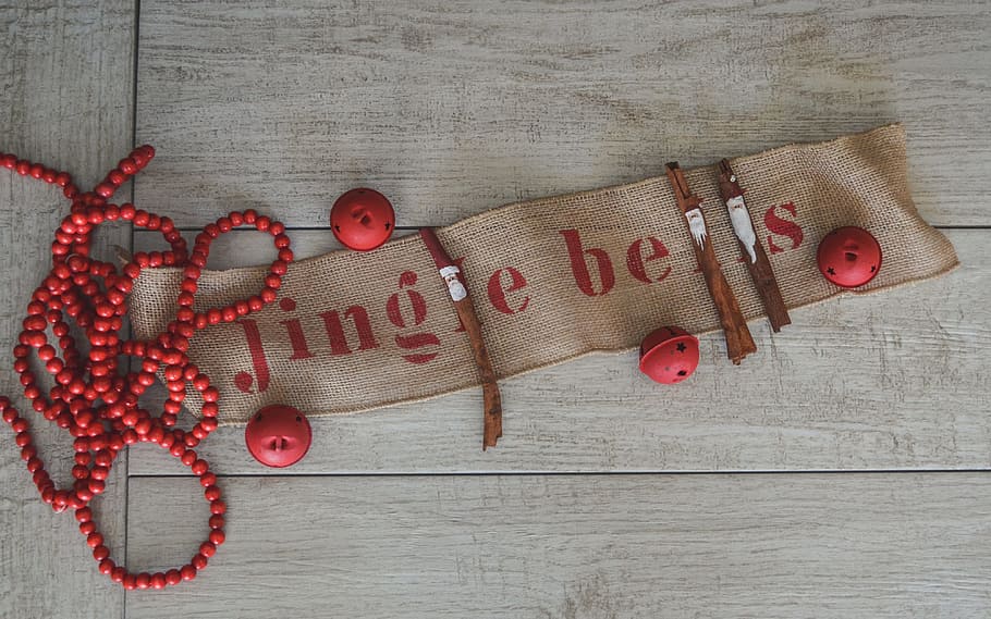 holidays, festive, decoration, red, from above, texture, jingle bells, cinnamon, sticks, garland