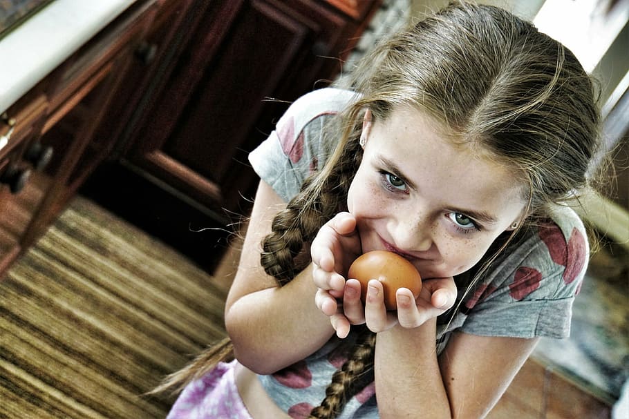 selective, focus photography, girl, holding, egg, crafty, sneaky, sly, cunning, young