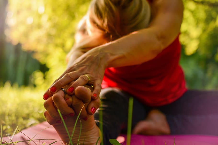 woman, wearing, red, shirt, gold wedding ring, working, yoga, calm, release, stretching