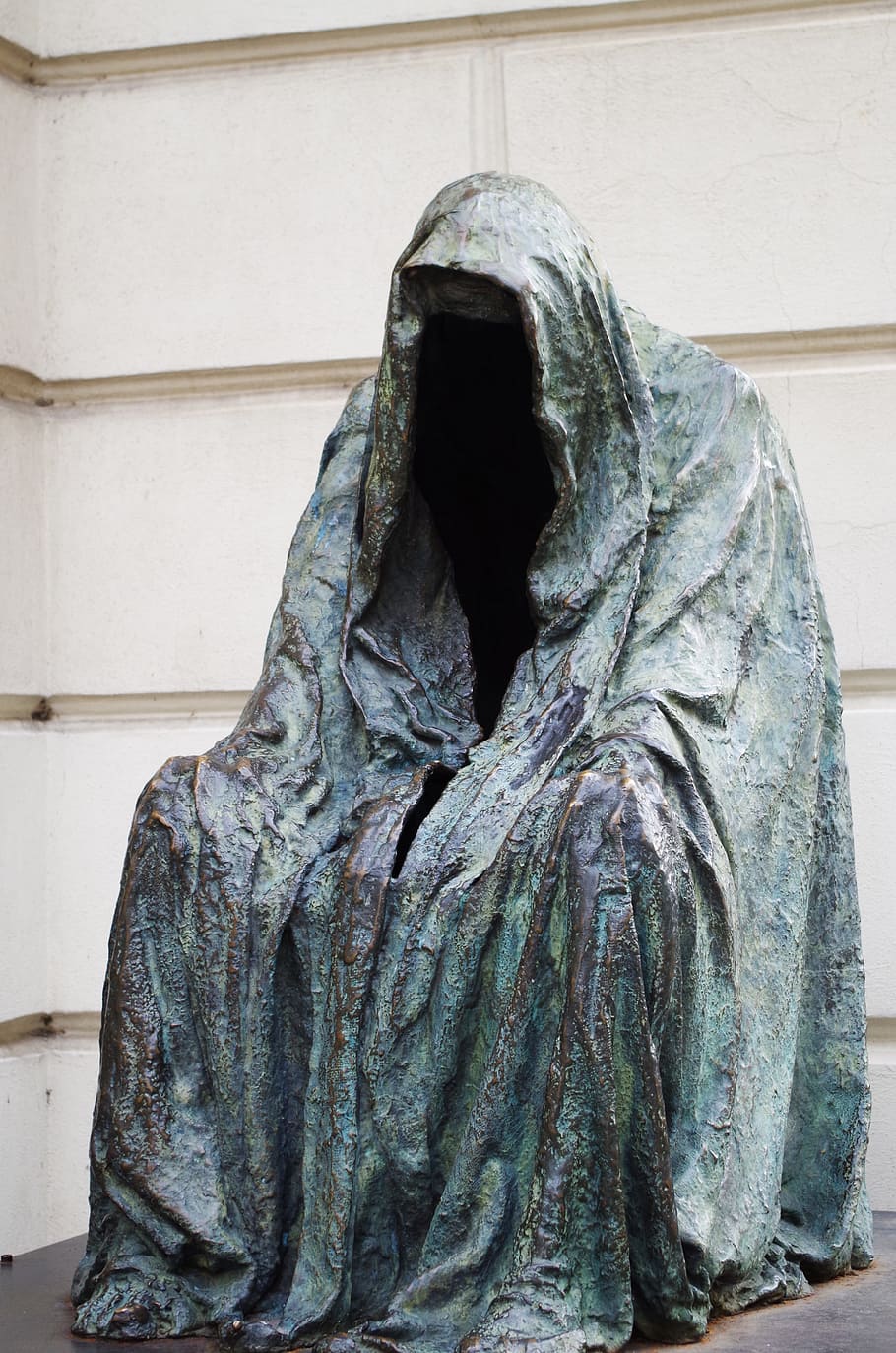 person, wearing, cape statue, the statue of, prague, garnish, sit, jacket, sculpture, statue
