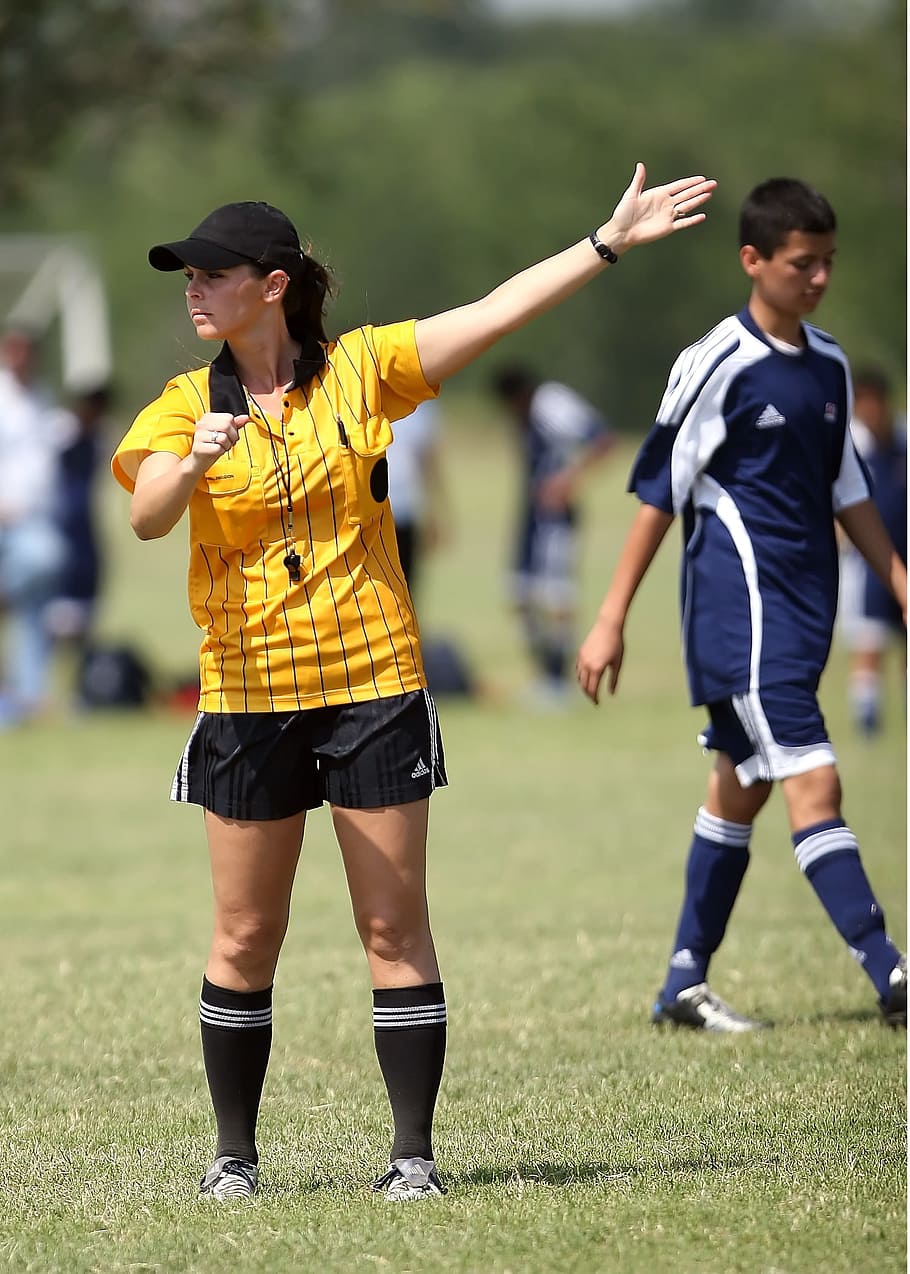 female, referee, rising, left, hand, green, open, field, soccer, football
