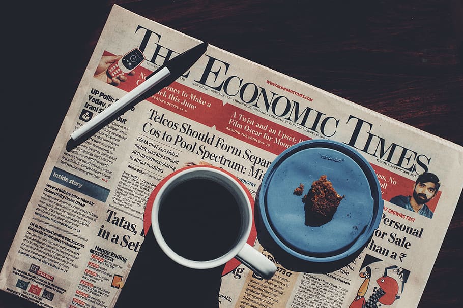 newspaper, table, Coffee cup, food/Drink, business, coffee, black background, drink, text, the media