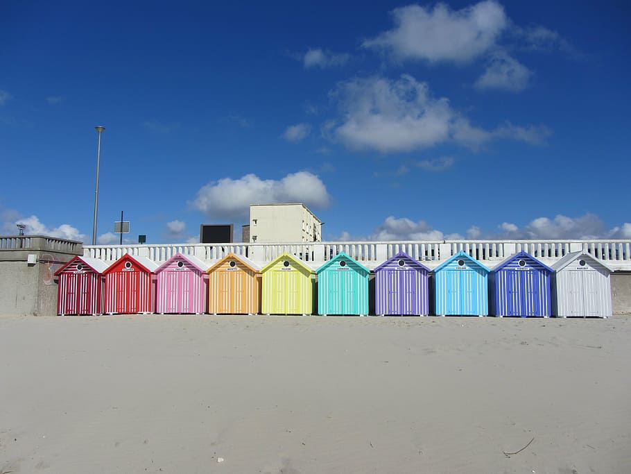 assorted-color wooden shacks, sea, place, stella beach, france, beach cabins, sky, built structure, cloud - sky, building exterior