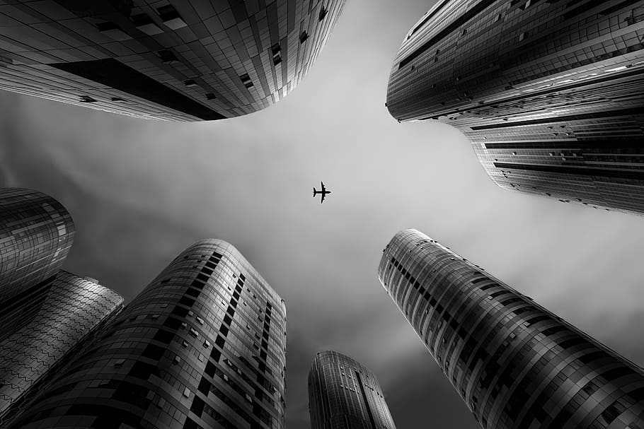 black and white, building, aircraft, leap, built structure, building exterior, architecture, office building exterior, city, tall - high