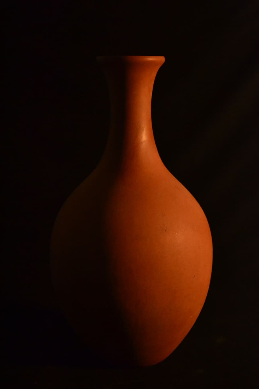 shadow, pot, static, claw, vase, light, black background, indoors, pottery, close-up