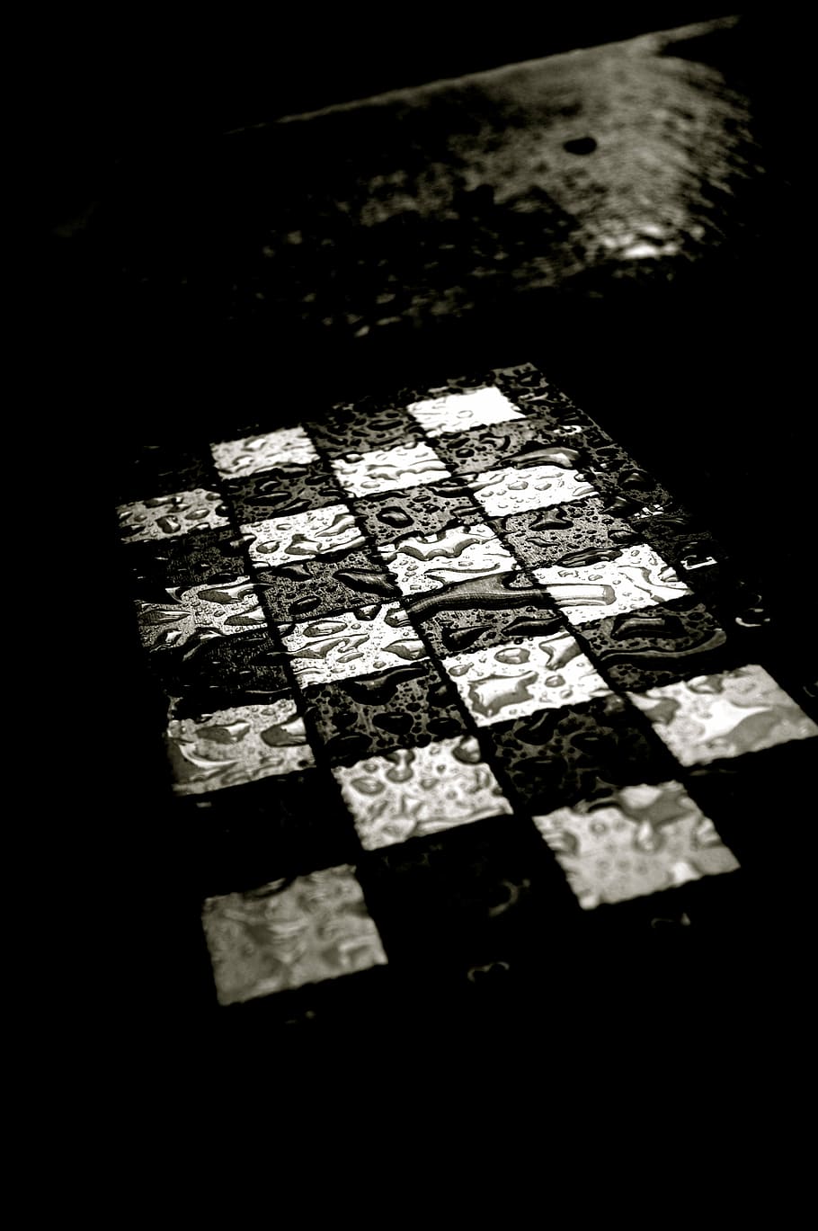 grayscale photo, checked, board, water, chess, chess board, rain, wet, black, white