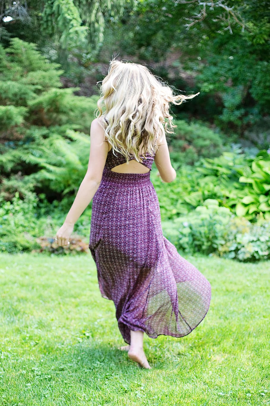 woman, purple, sleeveless dress, running, green, grass, purple dress, walking on, green grass, girl