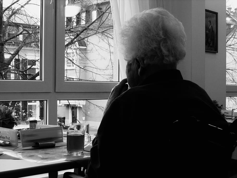 grayscale photo, person, sitting, window, woman, old, dependent, dementia, view, think