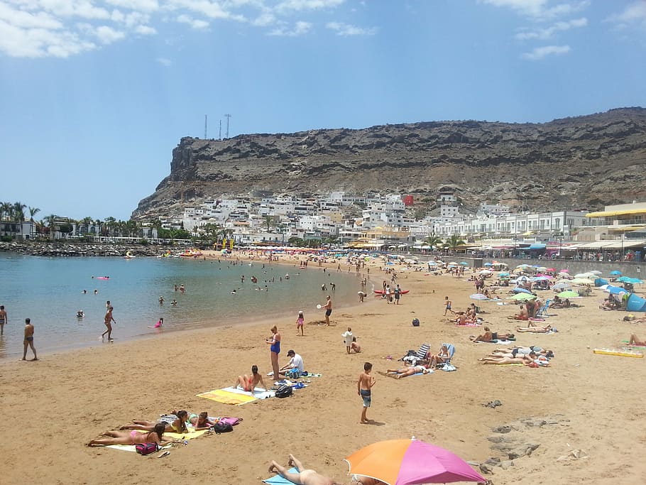 puerto de mogan, gran canaria, beach, sunbathing, sea, people, summer, sand, vacations, coastline