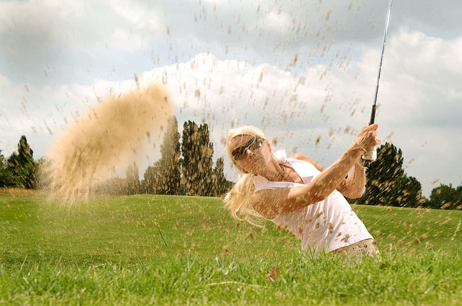 photograph, woman, holding, golf driver, green, grass field, golf, golfer, tee, golf clubs