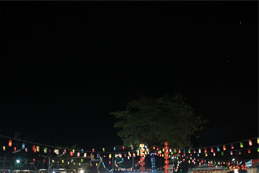assorted-color string lights, multicolored, hanging, decor, string lights, lanterns, dark, night, sky, large group of people