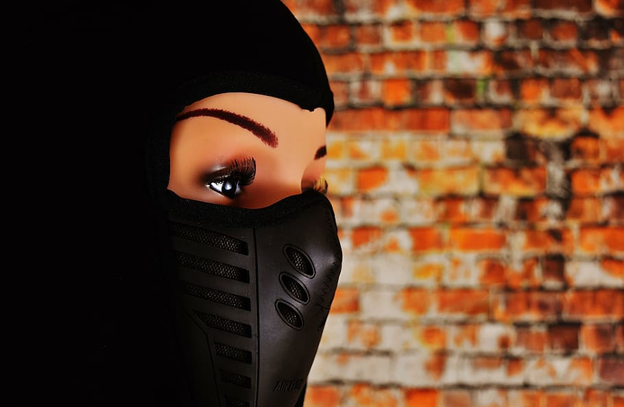 woman, ski mask, eyes, headwear, cap, doll, brick wall, young adult, one young woman only, only women