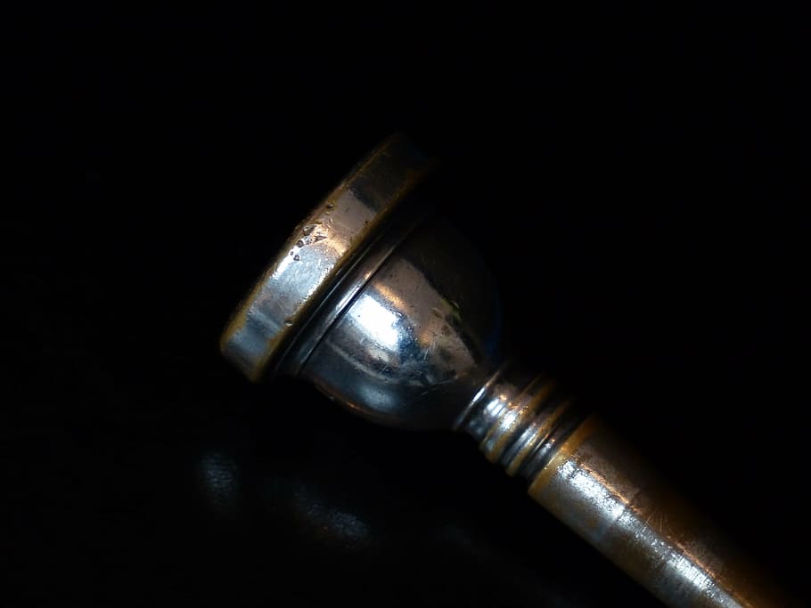 close-up photo, gray, metal rod, mouth piece, trombone, music, metal, brass, studio shot, black background