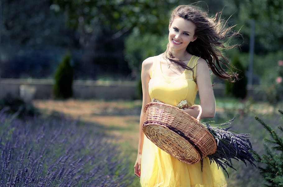 woman, yellow, sleeveless dress, carrying, brown, wicker basket, girl, lavender, cos, flowers