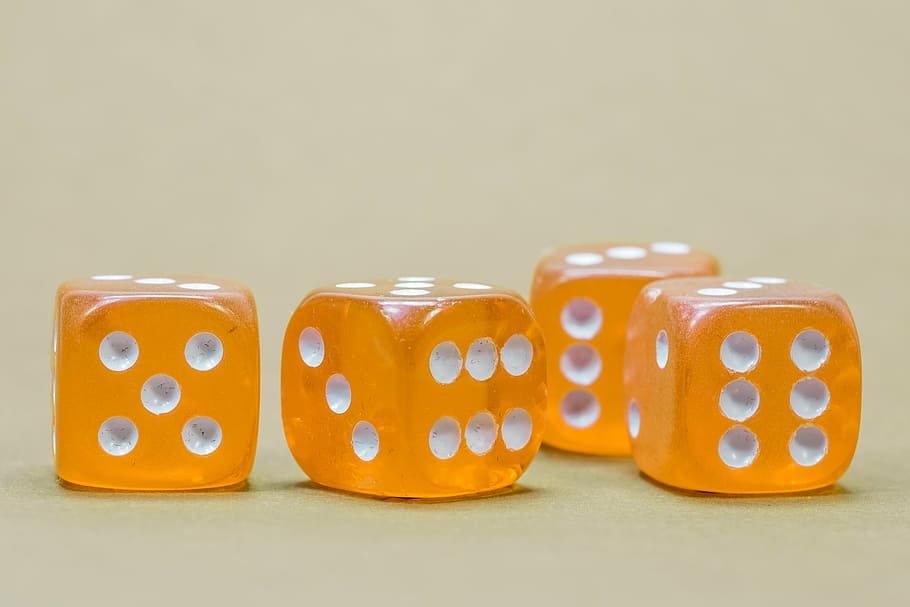 four orange-and-white dices, cube, game cube, instantaneous speed, pay, play, poker, play poker, gambling, toys