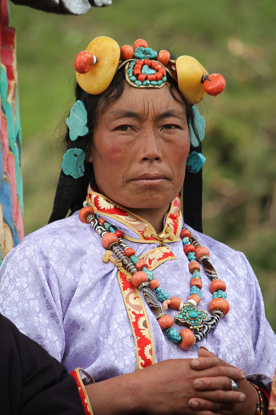 character, tibet ethnic, ms, real people, one person, portrait, front view, day, lifestyles, clothing