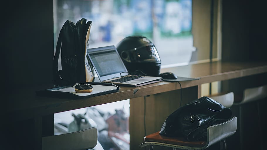 laptop, motorbike, helmet, bags, business, chair, computer, desk, monitor, donut