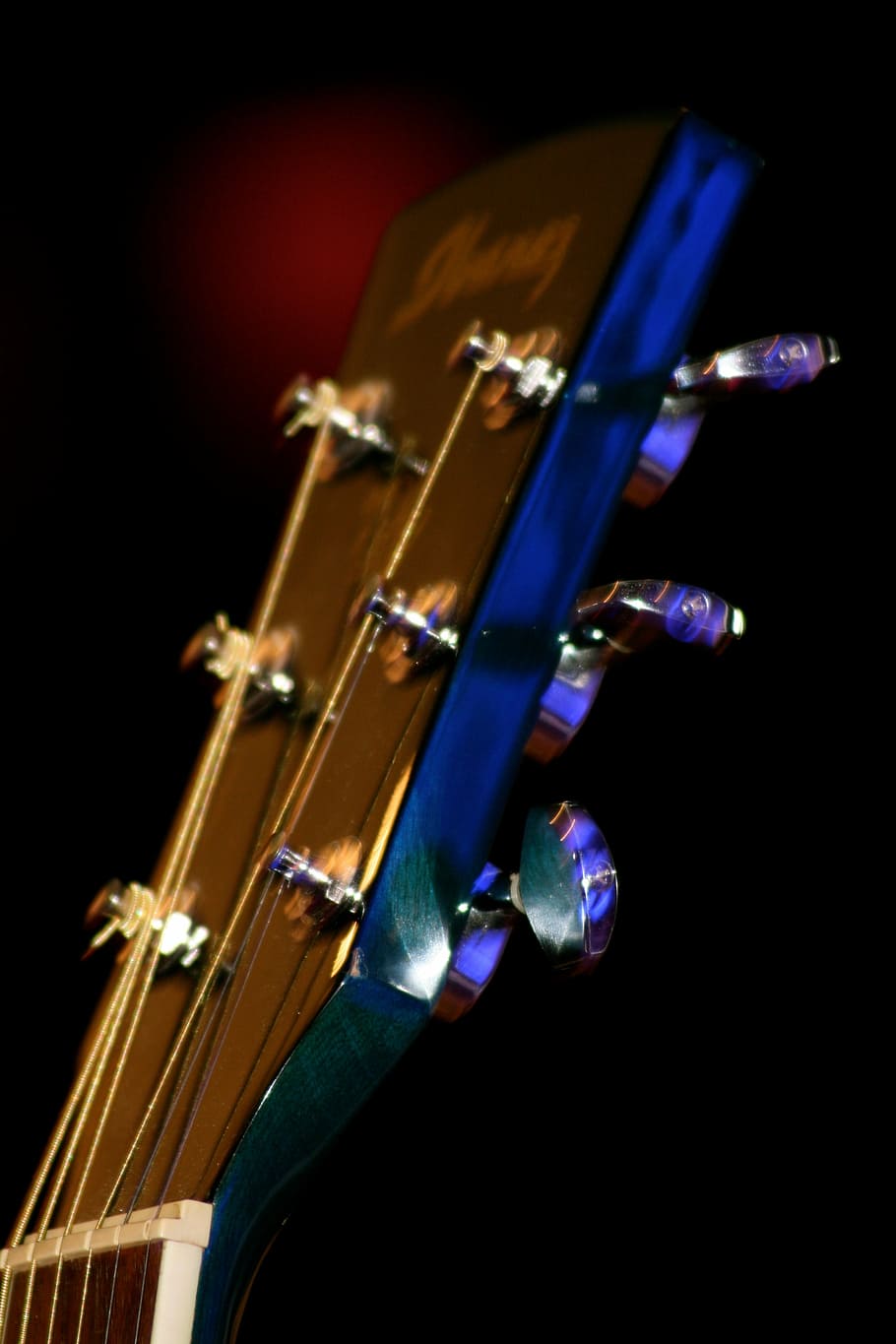 music, guitar, instrument, acoustic guitar, guitar head, close up, musical instrument, studio shot, black background, string instrument