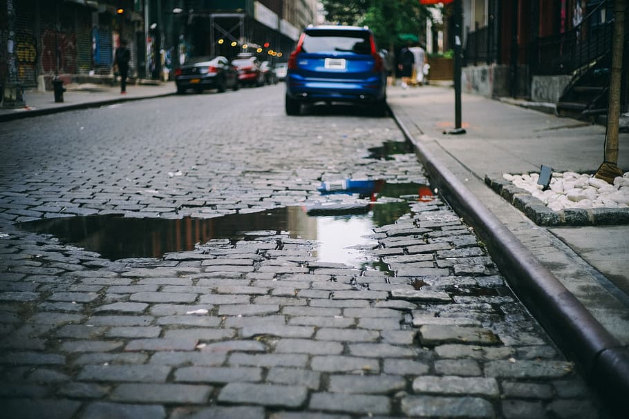 water, road, parked, vehicles, cars, city, cobblestones, outdoors, pavement, street