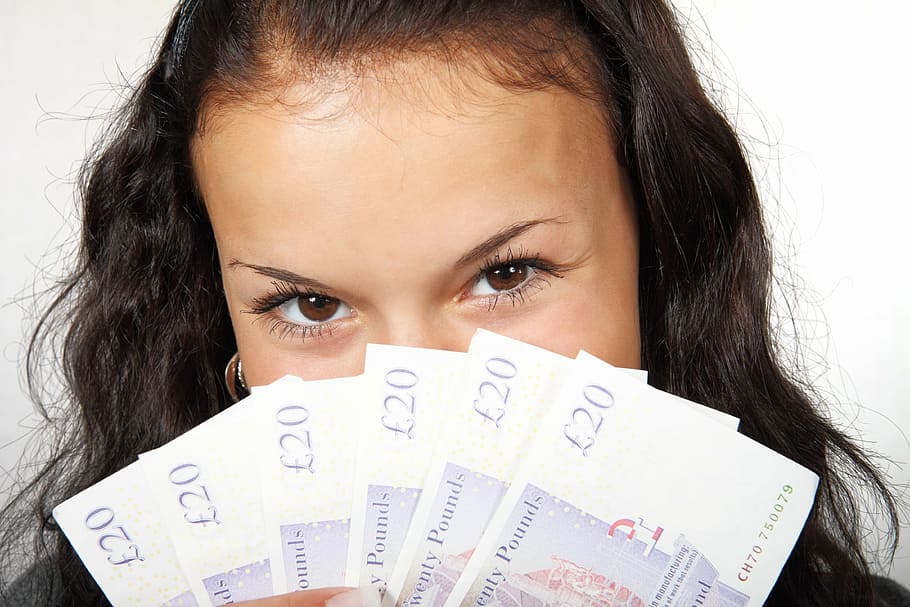 woman, holding, 20 english pound banknotes, banknote, business, cash, currency, eyes, fan, finance