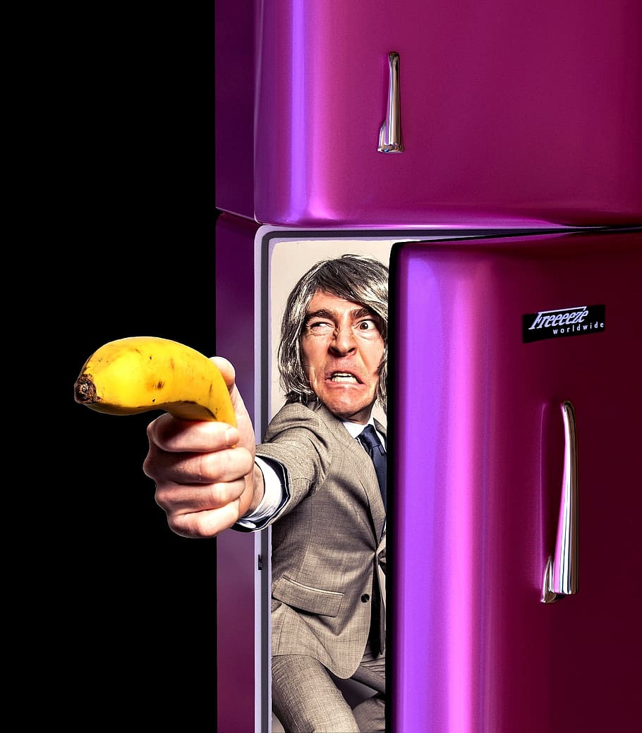 man, wearing, gray, suit jacket, holding, banana, purple, top-mount refrigerator, eat healthy, fruit