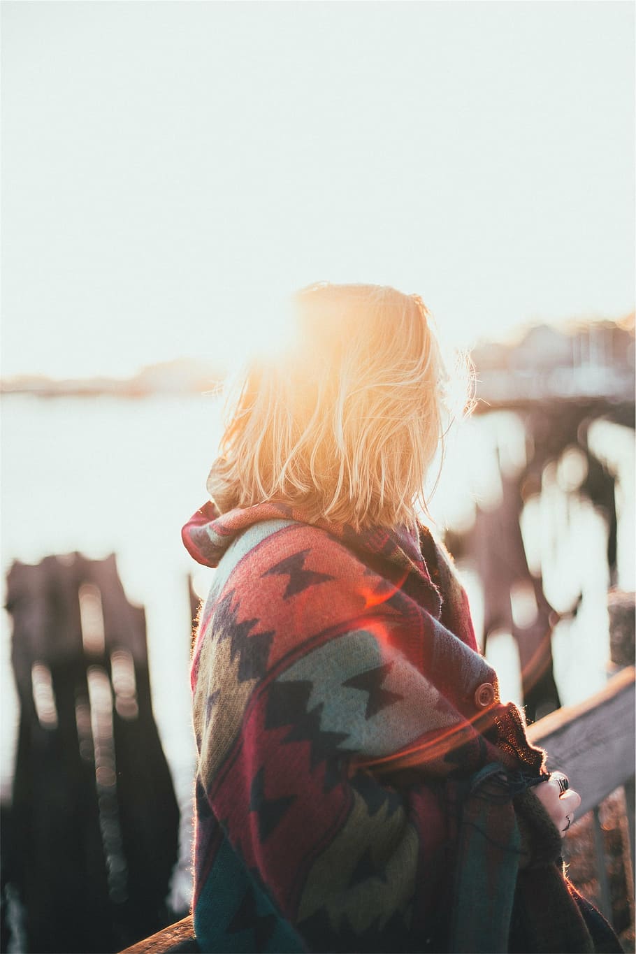 woman, standing, railing, wearing, red, blue, black, blanket, girl, sunshine