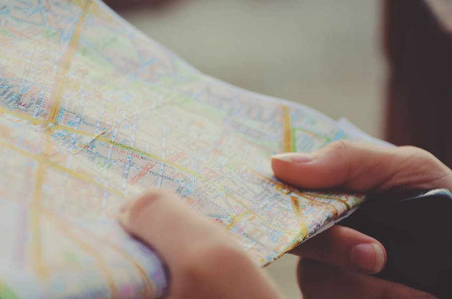 person holding map, map, navigation, hands, travel, route, journey, city, road, fingers