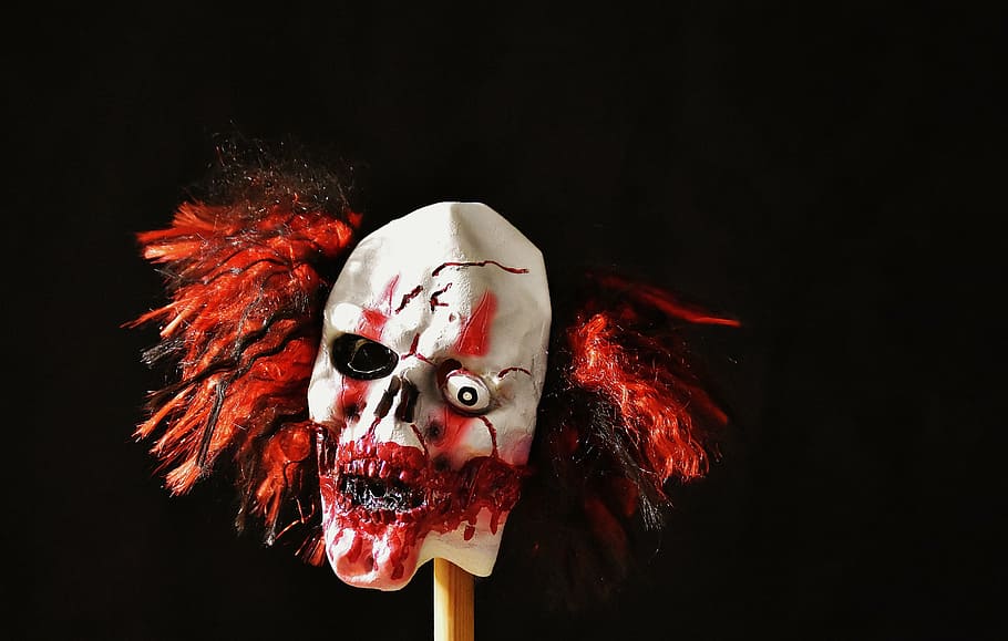 mask, carnival, horror clown, creepy, darkness, bloody, halloween, red, black background, studio shot