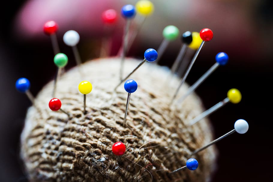 needle, red, green, blue, straight pin, multi colored, close-up, selective focus, indoors, focus on foreground