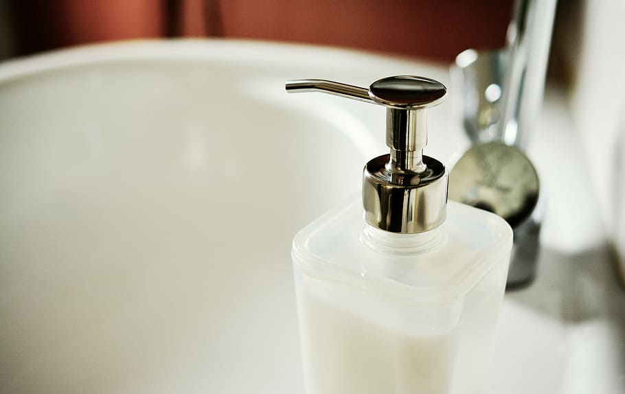 clear, glass, pump, bottle, ceramic, sink, soap dispenser, soap, liquid soap, bathroom sink