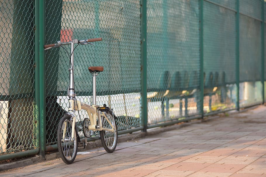 campus, tennis court, folding, transportation, city, architecture, mode of transportation, street, bicycle, fence