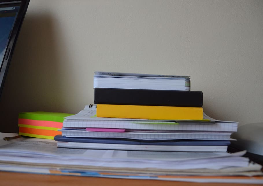 pile, books, desk, pink, paper, pink paper, papers, supplies, notebooks, pads