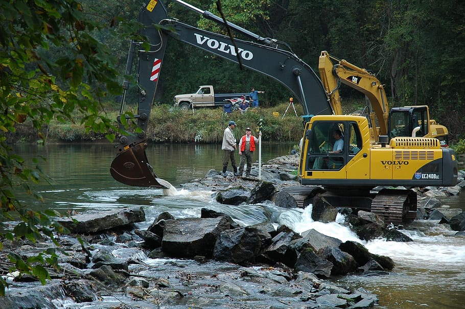 yellow, volvo excavator, rocks, river, people, equipment, heavy, backhoe, machine, construction