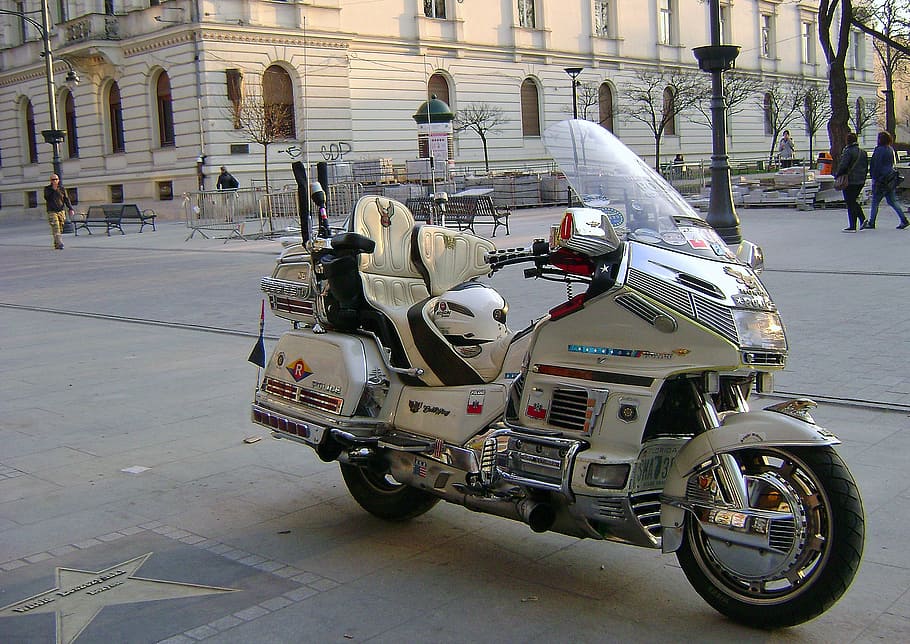motorcycle, the police, boat, piotrkowska street, the vehicle, city, architecture, incidental people, building exterior, built structure