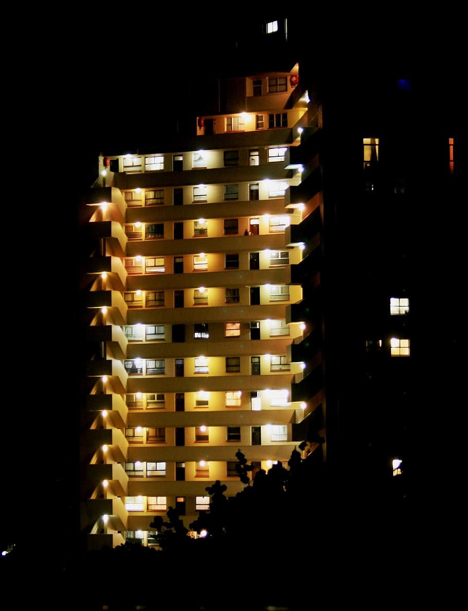 building, high rise, floors, windows, lights on, rows, pattern, glowing, shining, contrast