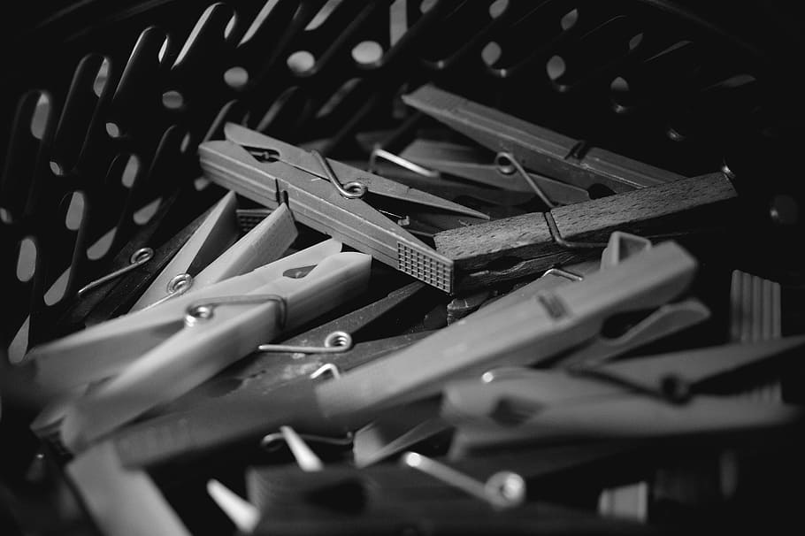 terminals, clothespin, clips in basket, black and white, photography, artistic, large group of objects, selective focus, abundance, still life