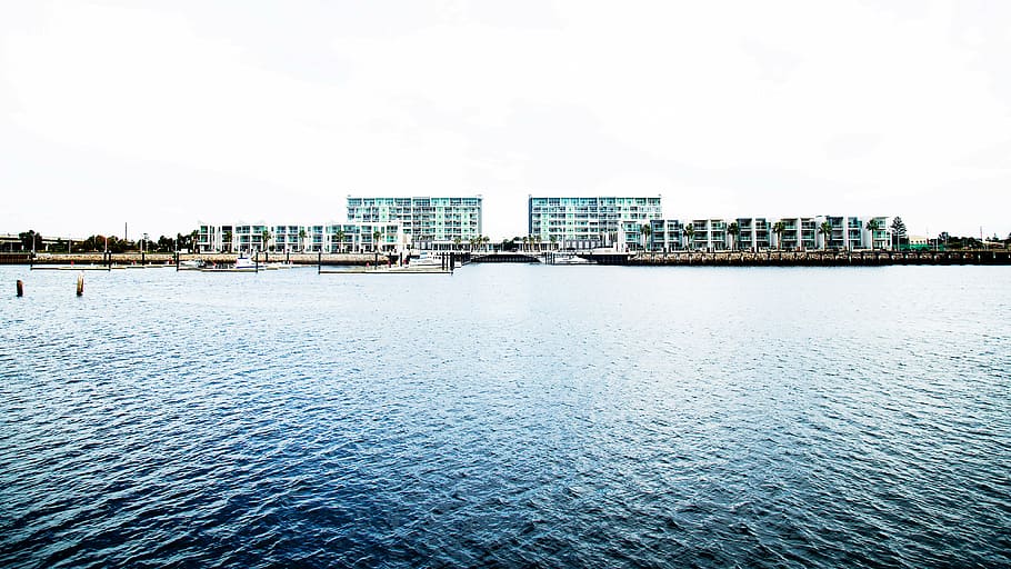 body, water, daytime, calm, near, high, rise, building, lake, buildings