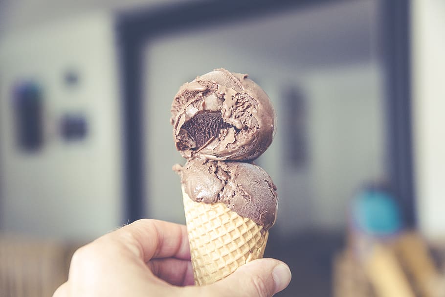 chocolate, ice cream, cone, food, dessert, hand, human hand, human body part, ice cream cone, focus on foreground