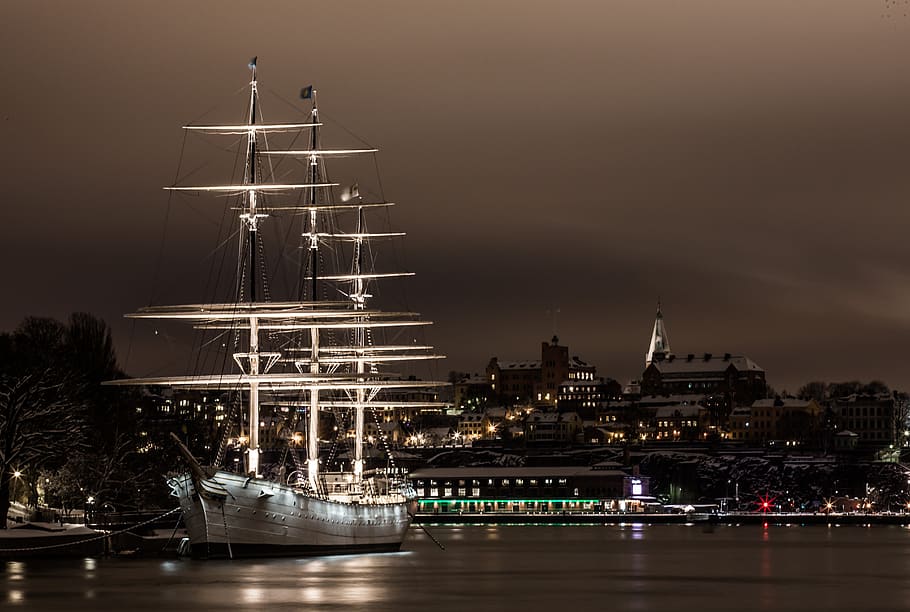 white, black, lighted, boat, sea, nighttime, sailboat, water, stockholm, ship