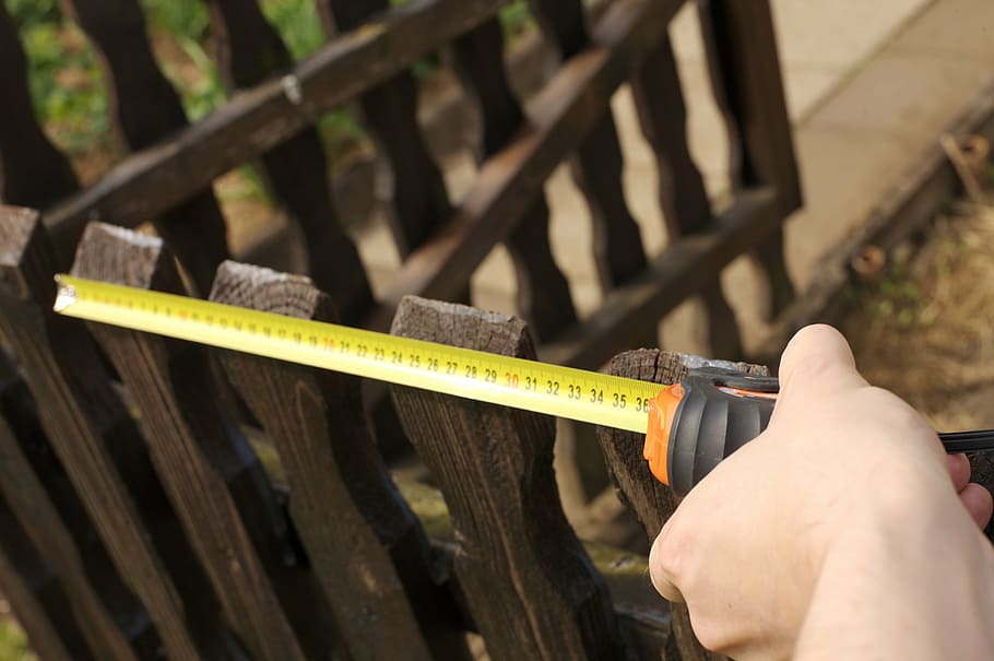 person measuring fence, tape measure, measure, meter, length, centimeter, roller tape measure, distance, craft, centimeters