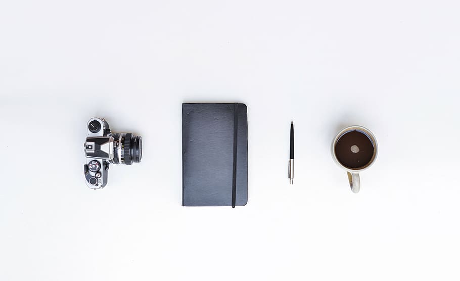 dslr camera, black, handbook, pen, mug, filled, coffee, white, surface, still life