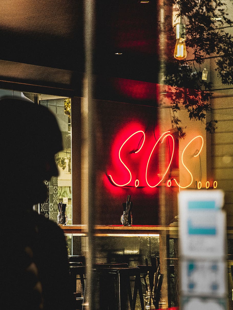 turned-on s.o.s, s.o.s., neon signage, reflecting, glass, neon, lights, restaurant, blur, night