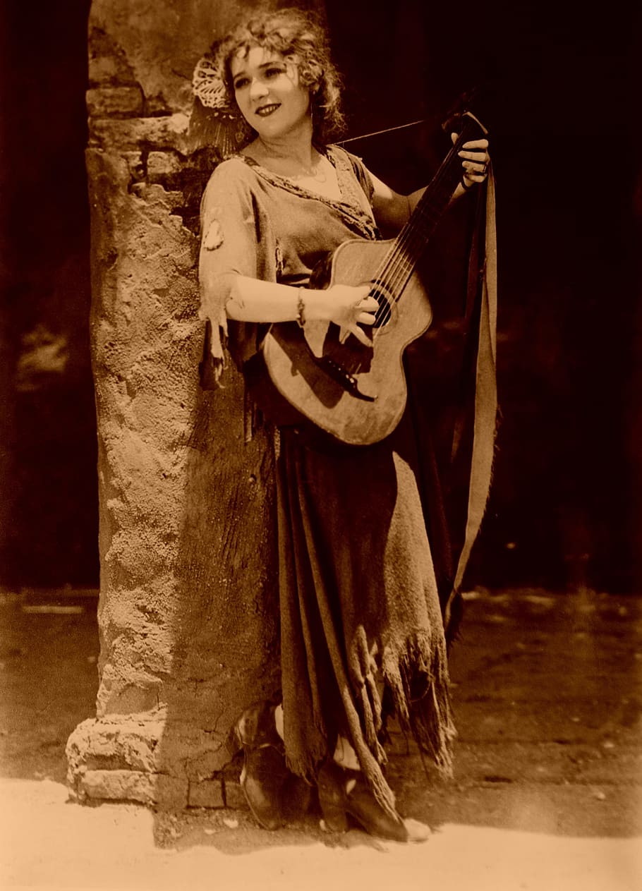 woman playing guitar, guitar, mary pickford, music, silent movies, cinema, film, musical instrument, arts culture and entertainment, string instrument