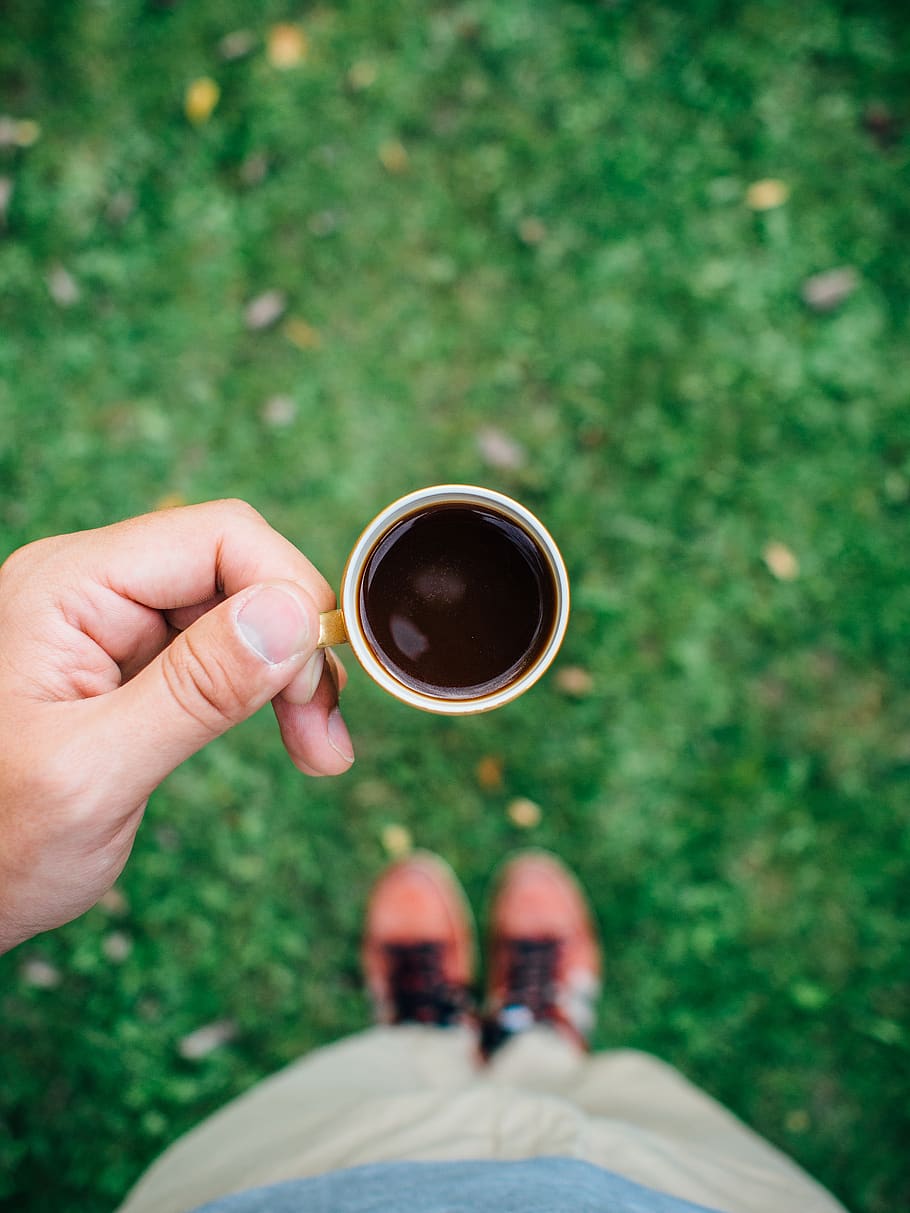 espresso, coffee, hands, grass, outside, food and drink, cup, real people, mug, human hand