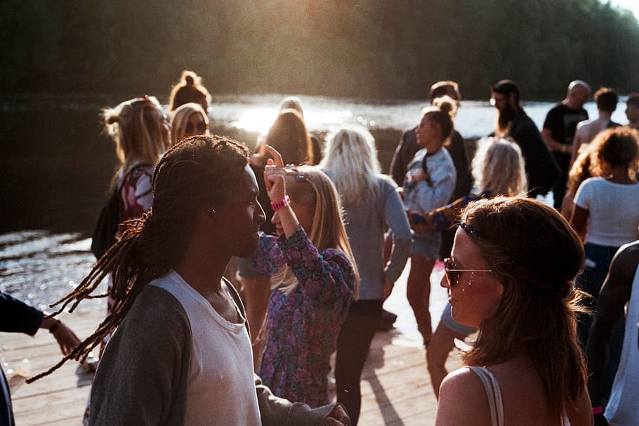 people dancing, river, tall, trees, daytime, people, man, woman, dreadlocks, party