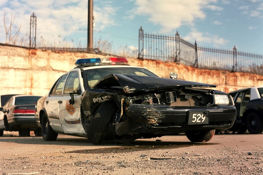 wrecked, black, white, police cruiser, vehicles, parked, lot, daytime, police, cleveland
