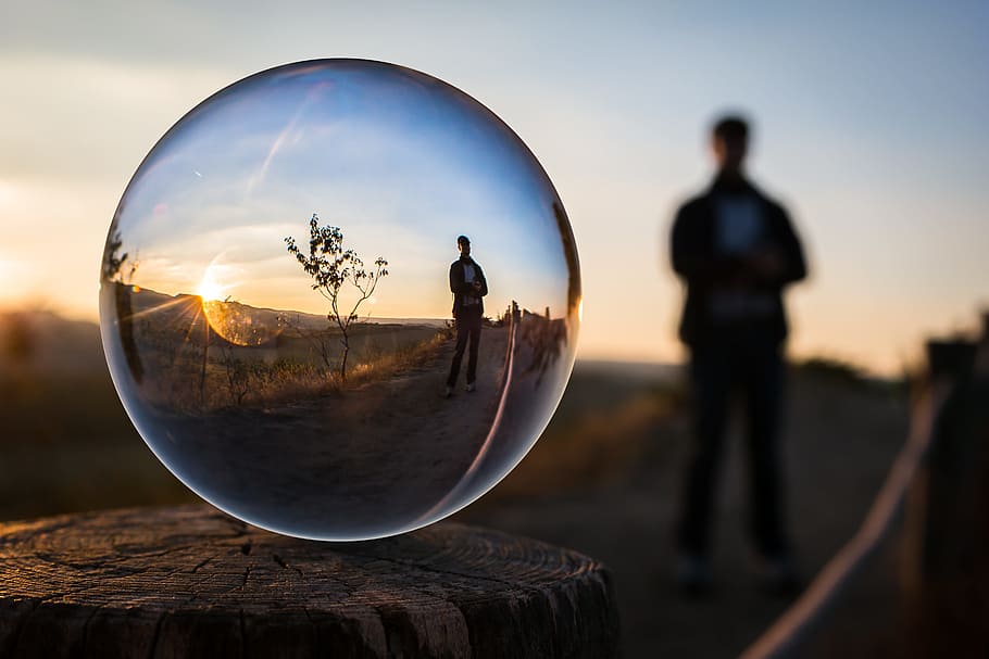 water drop photography, man, standing, tree, glass ball, evening, sunset, human, photo sphere, globe image